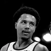 A man wearing a customized sports jersey by owayo, captured in black and white.