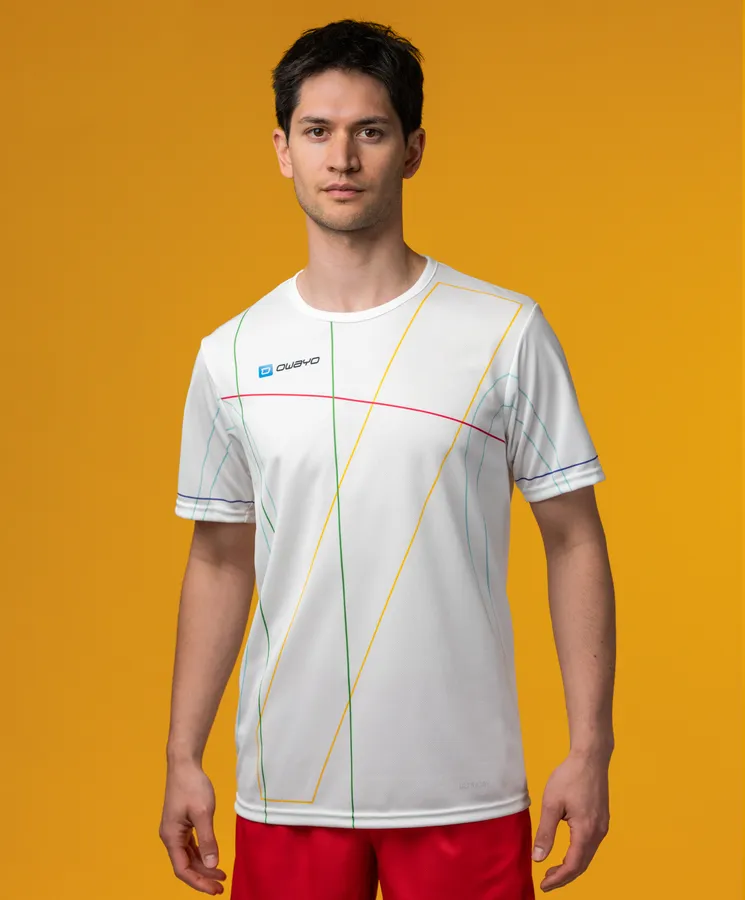 A male model is wearing a white sports shirt with colorful line patterns against a yellow background.