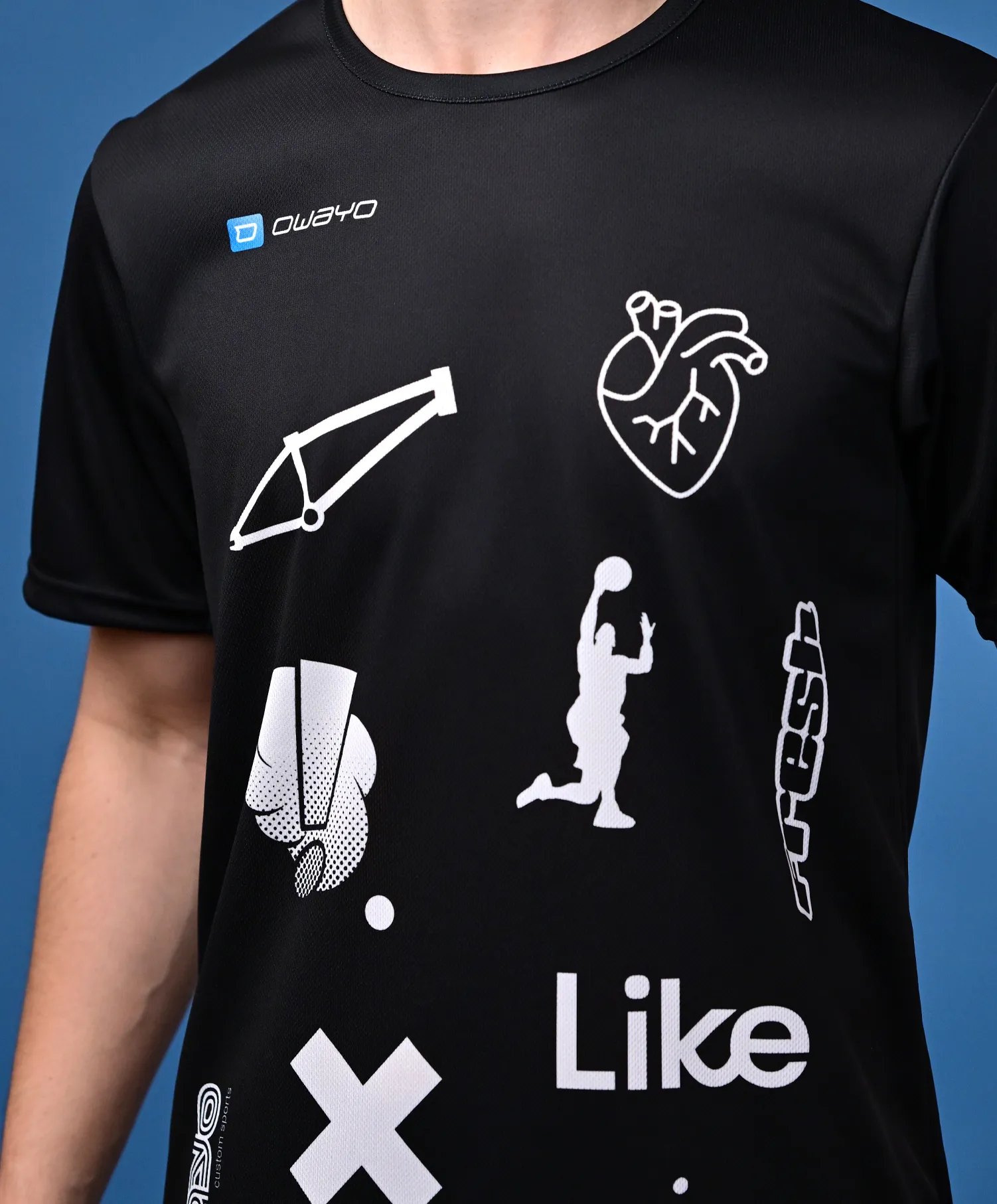 A black sports shirt featuring white graphic designs, including symbols for basketball, a heartbeat, and other sports elements.